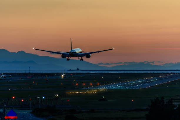 Modern air service in the airport for passengers and luggage, comfort and quality A beautiful landing of an airplane on the runway in a modern airport airports canada stock pictures, royalty-free photos & images