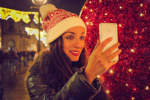 istock young woman, talking on mobile phone. It's a Christmas time 885630712