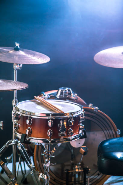 istock musical instruments drum kit, flash of light, a beautiful light in the background with copy space 885643920