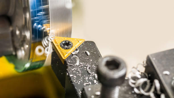 istock Detail of tool bit when machining on a lathe 885650558