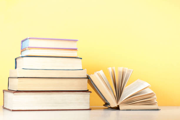 istock Open book, hardback books on wooden table. Education background. Back to school. Copy space for text. 885651000