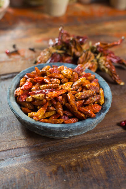 istock Red hot chili pepper dried on wooden background 885655814