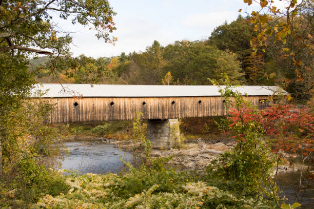 istock Covered bridge in rural Vermont in fall 885662638