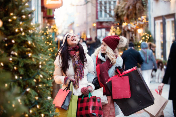 istock Christmas Shopping with two young women 885670348