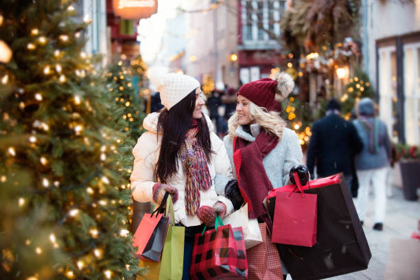 istock Christmas Shopping with two young women 885670500