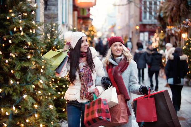 istock Christmas Shopping with two young women 885670502