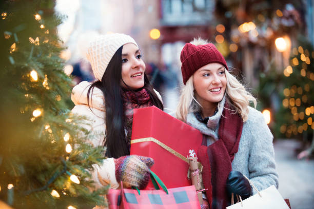 istock Christmas Shopping with two young women 885672848