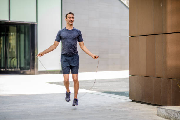 istock Man exercising with jump-rope outdoors 885672906