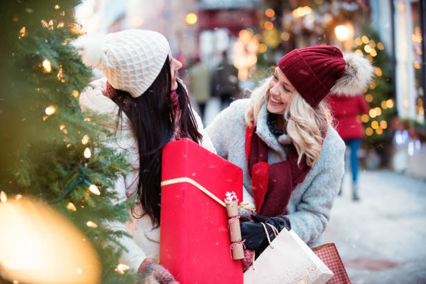 istock Christmas Shopping with two young women 885672914
