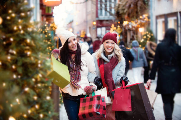 istock Christmas Shopping with two young women 885685400