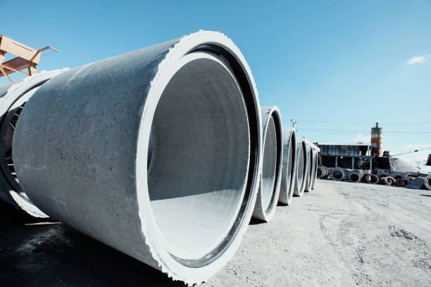 istock Stack of concrete drainage pipes for wells and water discharges 885690398