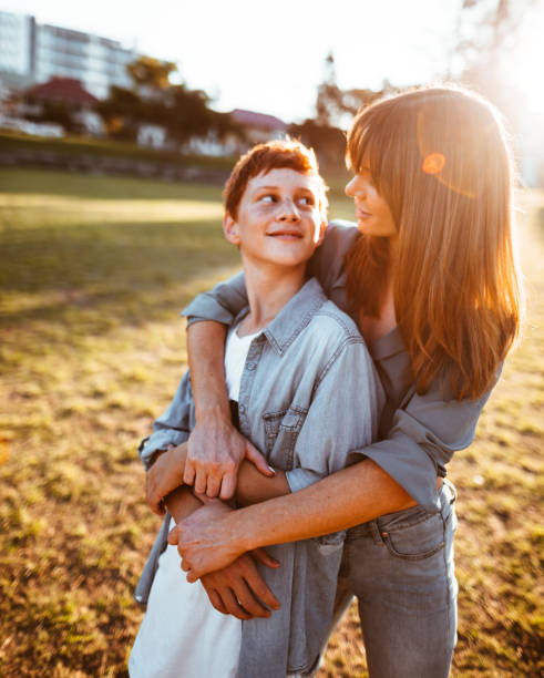 istock teenager embraced with mom 885711950