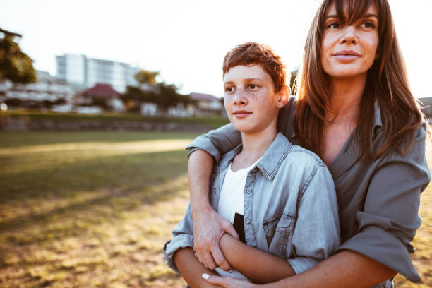 istock teenager embraced with mom 885712020