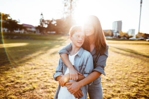 istock teenager embraced with mom 885712056