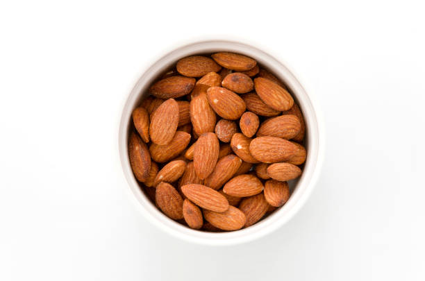 istock group of almonds isolated on white dish 885712202