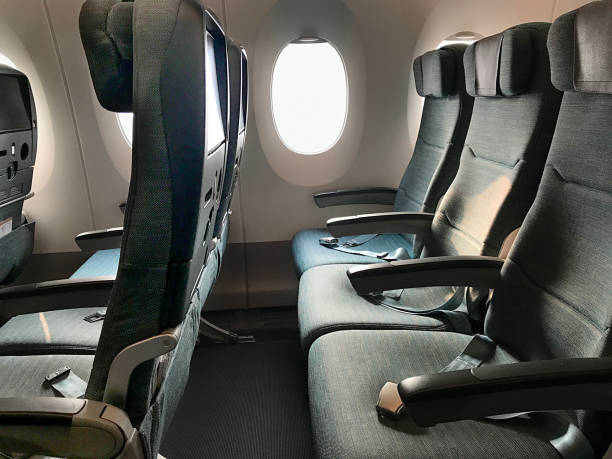 Empty airplane seats in an airplane stock photo
