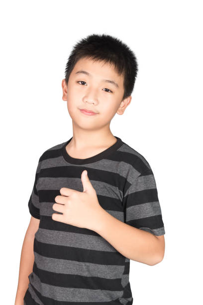 istock Asian boy kid making, showing thumbs up with a Smiling, isolated on white. 885730776
