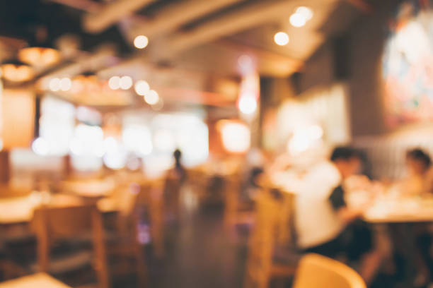 istock Restaurant cafe or coffee shop interior with people abstract blur background 885730898