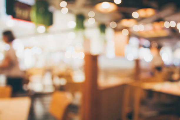 istock Restaurant cafe or coffee shop interior with people abstract blur background 885730900