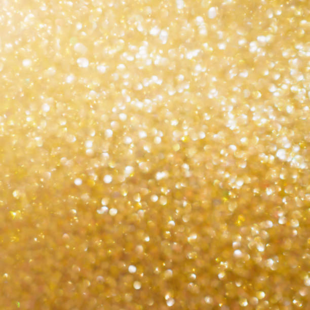 istock Christmas golden glow bokeh light blur abstract Background 885731744