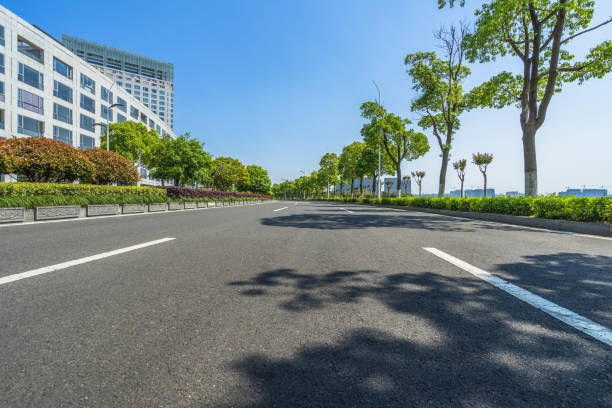 istock Empty road front of modern buildings 885736978