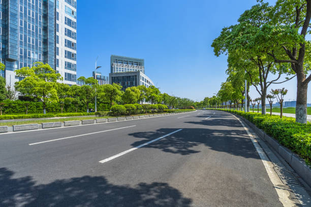 istock Empty road front of modern buildings 885739872