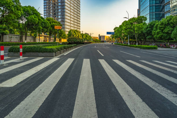 istock Empty road front of modern buildings 885742290
