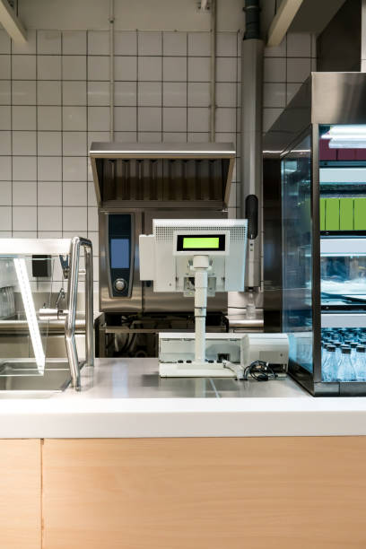 Empty cash desk with payment terminal in supermarket stock photo