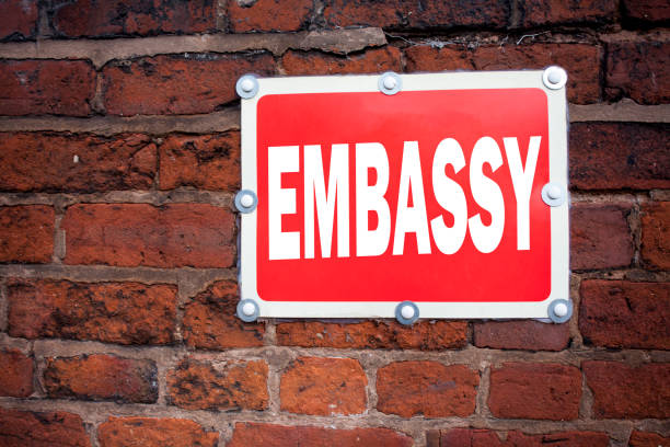 istock Hand writing text caption inspiration showing Embassy concept meaning Tourist Visa Application written on old announcement road sign with background and copy space 885759502