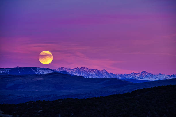 Sunset and stars at dusk in Carpathian mountain range. Ukraine.