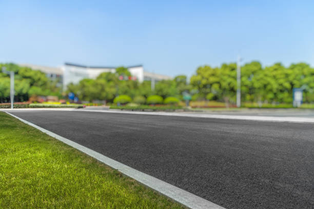 istock City empty road with modern buildings background 885786360