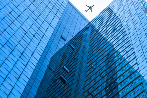 istock Plane flying over the skyscrapers 885788788