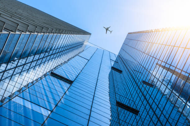 istock Plane flying over the skyscrapers 885789132