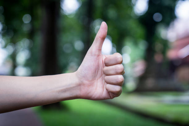 istock women hand is showing Thumbs up 885794296