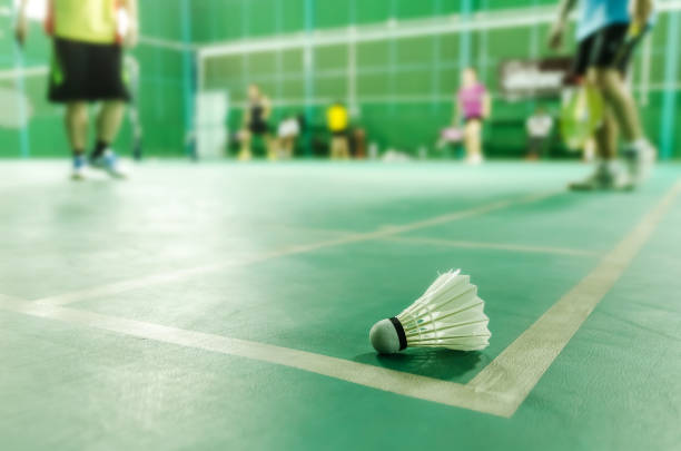 istock badminton courts with shuttlecocks in the foreground 885796658