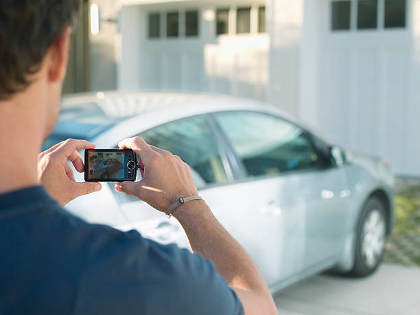 Man photographing new car  driveway photos stock pictures, royalty-free photos & images