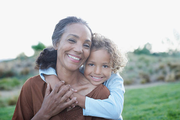 boy hugging grandmother - 50 54 jaar fotos stockfoto's en -beelden