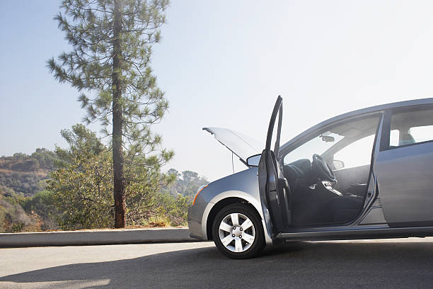 broken down car on side of road - vehicle breakdown stockfoto's en -beelden