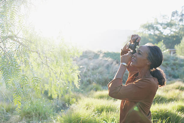Woman photographing nature  indigenous peoples of the americas photos stock pictures, royalty-free photos & images
