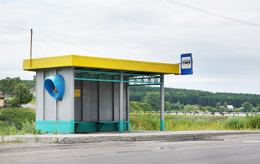 Old bus stop on the road in the countryside