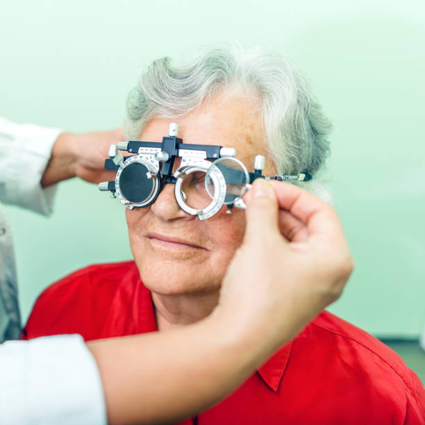 istock Senior woman having her eyes checked at ophthalmologist 885860890