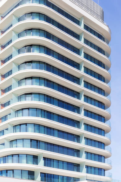 istock Rows of balconies in white apartment building 885871376