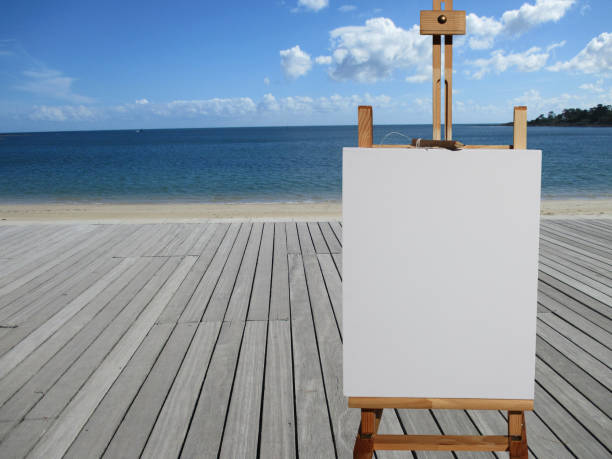 istock Painting on an easel  Littoral  Wooden deck Beach 885887024