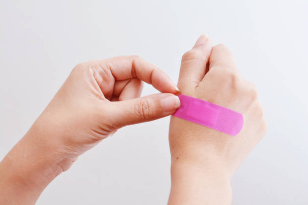 istock Woman hand with adhesive tape. 885902604