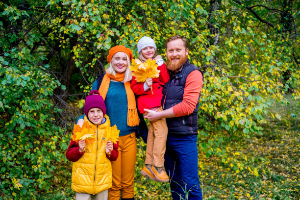 istock Family in an autumn park 885902822