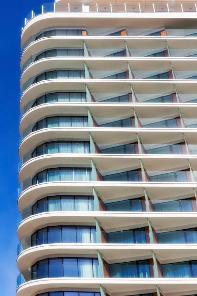istock Rows of balconies in white apartment building 885907814