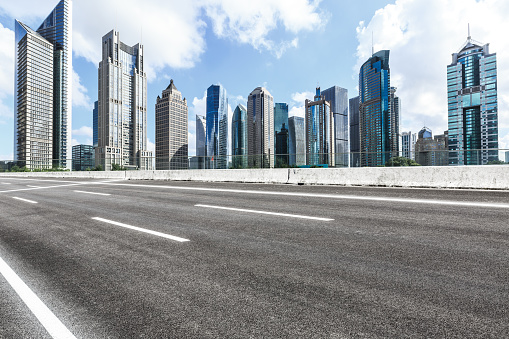 Asphalt highway and modern city commercial buildings in Shanghai,China