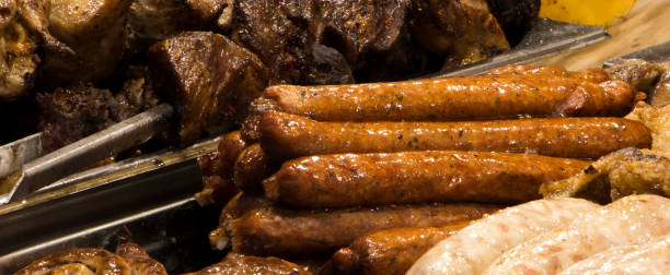 istock Grilling sausages on barbecue grill. 885908042