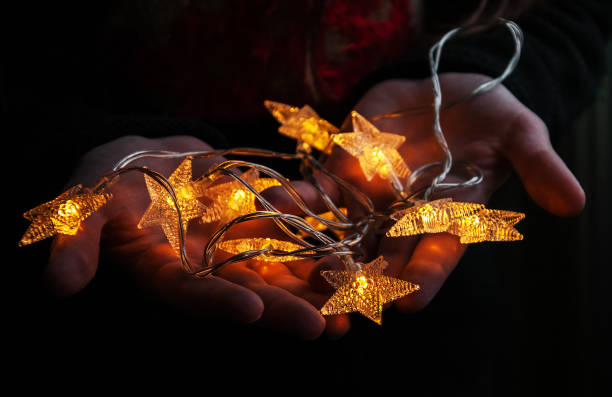 istock Electric garland in the hands 885920050