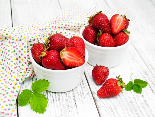 istock ripe strawberries on wooden table 885920054
